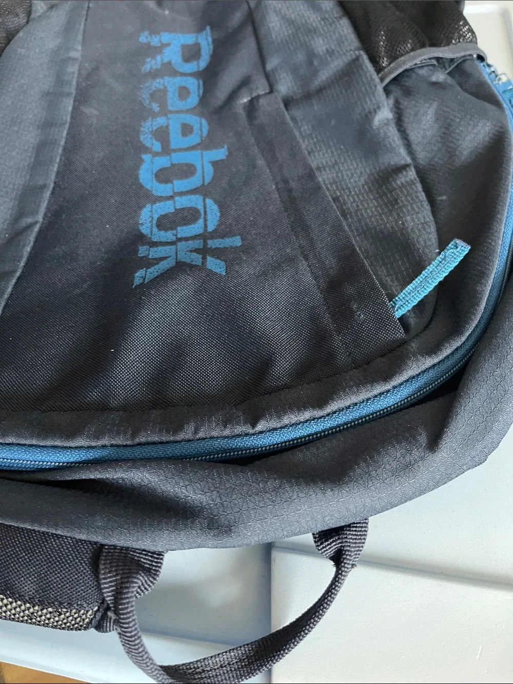 Reebok Black Backpack with Blue Logo and Trim